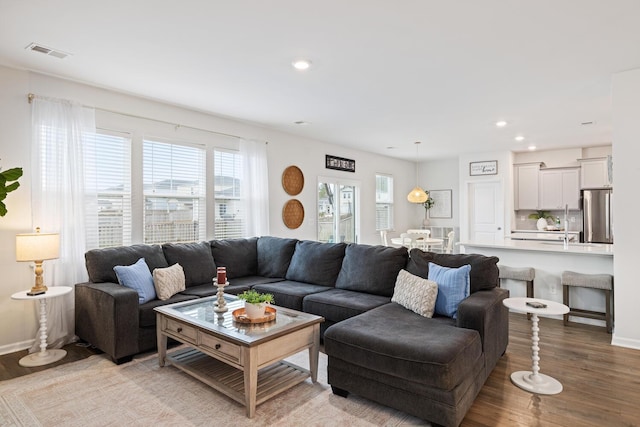 living room with light hardwood / wood-style floors