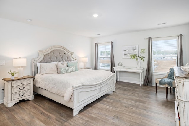 bedroom featuring dark hardwood / wood-style floors