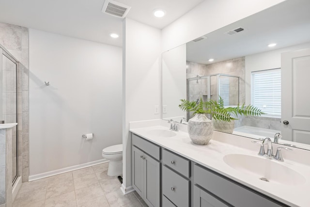 full bathroom with vanity, shower with separate bathtub, and toilet