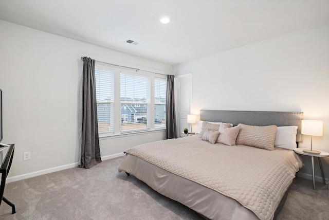 bedroom with light carpet