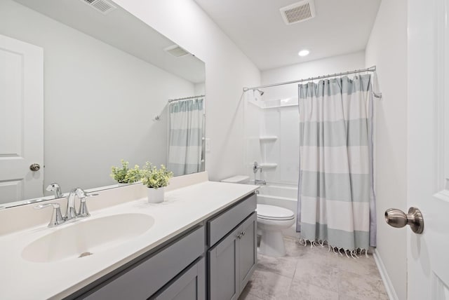 full bathroom featuring vanity, shower / bath combination with curtain, and toilet