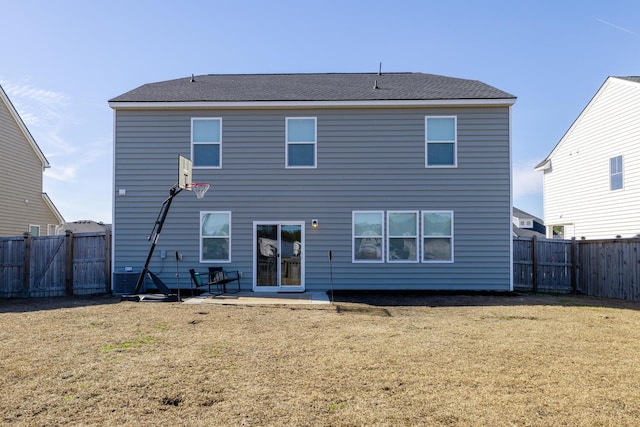 back of property featuring a patio area and a lawn