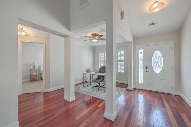 entryway with baseboards, visible vents, and hardwood / wood-style floors