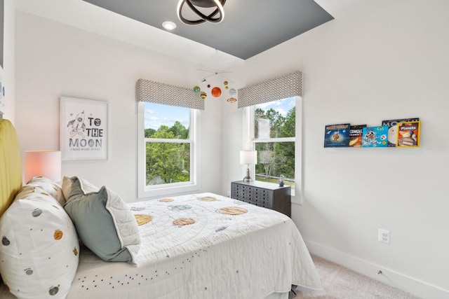 bedroom with carpet flooring and baseboards