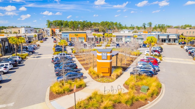 view of community featuring uncovered parking