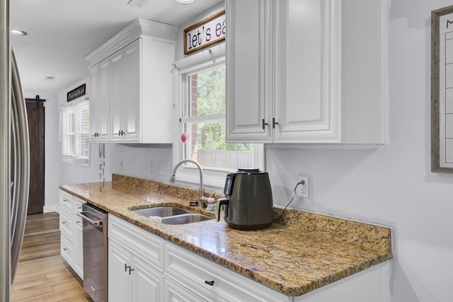 1861 Jaywood Cir, Charleston, SC 29407 - kitchen featuring white cabinets, stainless steel appliances, a sink, and plenty of natural light