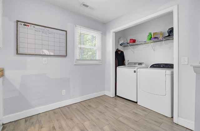 1861 Jaywood Cir, Charleston, SC 29407 - laundry room featuring washing machine and dryer, light wood-style flooring, visible vents, and laundry area