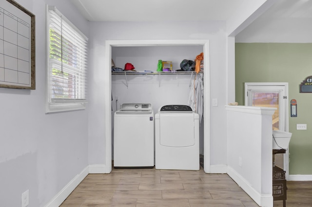 1861 Jaywood Cir, Charleston, SC 29407 - clothes washing area featuring wood finished floors, laundry area, baseboards, and washer and clothes dryer