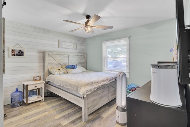 1861 Jaywood Cir, Charleston, SC 29407 - bedroom featuring wooden walls, light wood-type flooring, and a ceiling fan