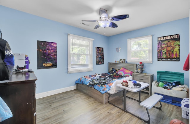 1861 Jaywood Cir, Charleston, SC 29407 - bedroom with wood finished floors, visible vents, baseboards, and multiple windows