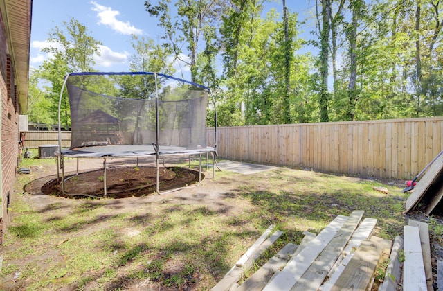 1861 Jaywood Cir, Charleston, SC 29407 - view of yard with a fenced backyard and a trampoline