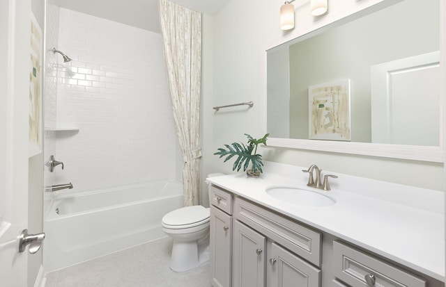 full bath with toilet, vanity, tile patterned floors, and shower / tub combo