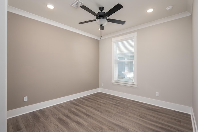 spare room featuring baseboards, visible vents, crown molding, and ceiling fan