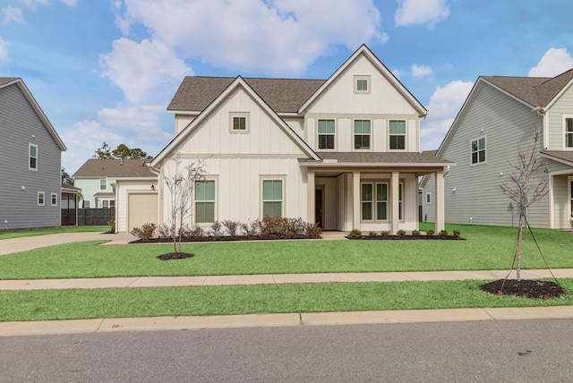 view of front facade featuring a front yard and a garage