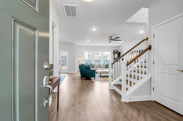 entryway featuring hardwood / wood-style flooring and ceiling fan