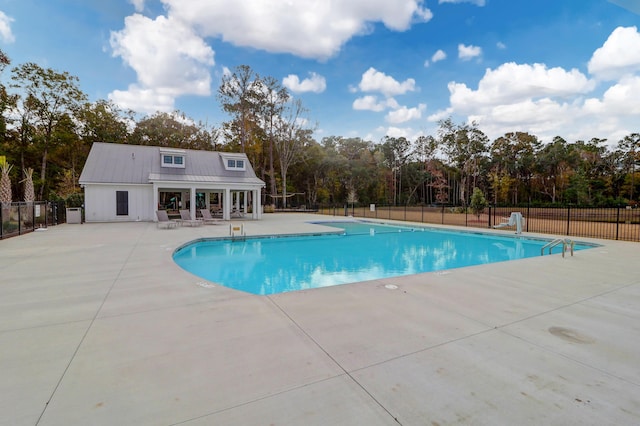 view of swimming pool featuring a patio area