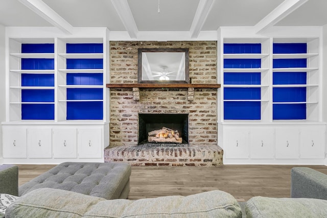 1909 Swift Ave, Charleston, SC 29407 - living area featuring beam ceiling, wood finished floors, ceiling fan, a brick fireplace, and built in shelves