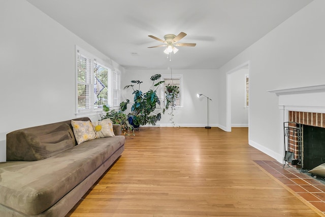 1909 Swift Ave, Charleston, SC 29407 - living room with a ceiling fan, light wood-style flooring, and a fireplace