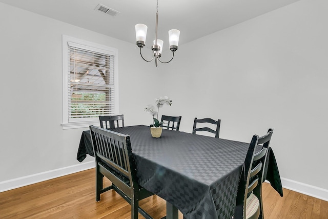 1909 Swift Ave, Charleston, SC 29407 - dining room with a chandelier and light wood-type flooring