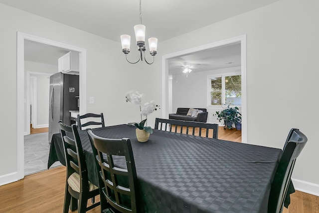 1909 Swift Ave, Charleston, SC 29407 - dining space featuring a chandelier, light wood finished floors, and a ceiling fan