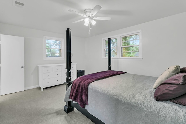1909 Swift Ave, Charleston, SC 29407 - bedroom featuring multiple windows, light carpet, and a ceiling fan