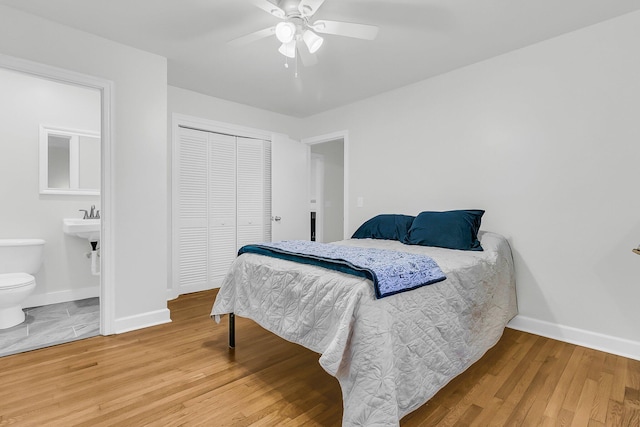 1909 Swift Ave, Charleston, SC 29407 - bedroom with wood finished floors, a closet, ensuite bath, and a ceiling fan