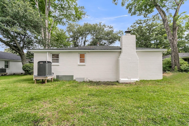 1909 Swift Ave, Charleston, SC 29407 - rear view of house with a chimney and a yard