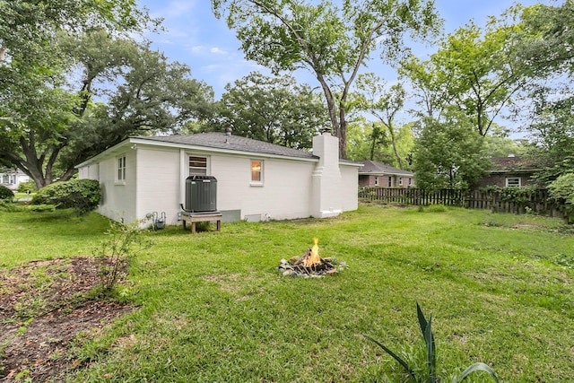 1909 Swift Ave, Charleston, SC 29407 - rear view of house with an outdoor fire pit and a chimney