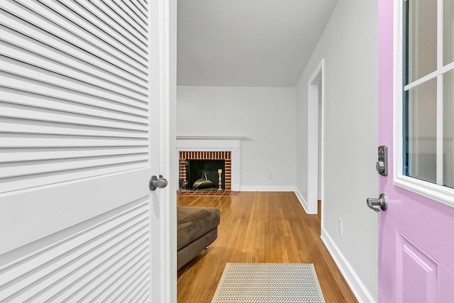 1909 Swift Ave, Charleston, SC 29407 - living room with light wood-type flooring and a brick fireplace