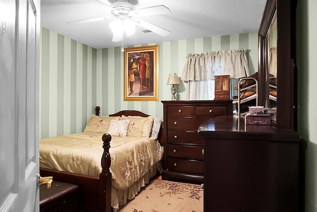 8692 Bentwood Dr, North Charleston, SC 29406 - bedroom featuring wallpapered walls, a ceiling fan, and a textured ceiling