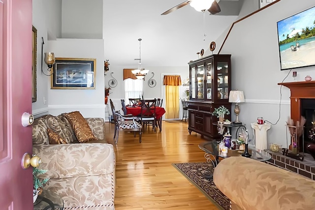 8692 Bentwood Dr, North Charleston, SC 29406 - living room featuring a ceiling fan, wood finished floors, and a chandelier