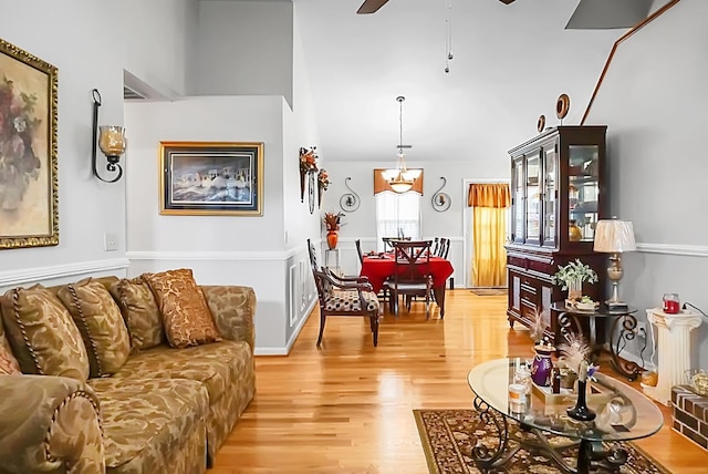 8692 Bentwood Dr, North Charleston, SC 29406 - living room featuring light wood-style flooring, a chandelier, ceiling fan, and lofted ceiling