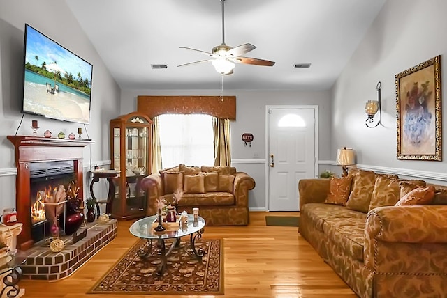 8692 Bentwood Dr, North Charleston, SC 29406 - living area featuring a ceiling fan, lofted ceiling, wood finished floors, and a brick fireplace