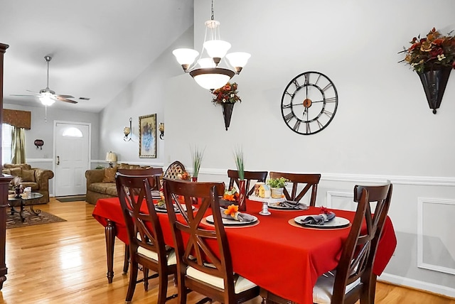 8692 Bentwood Dr, North Charleston, SC 29406 - dining area with lofted ceiling, wood finished floors, ceiling fan, and a chandelier