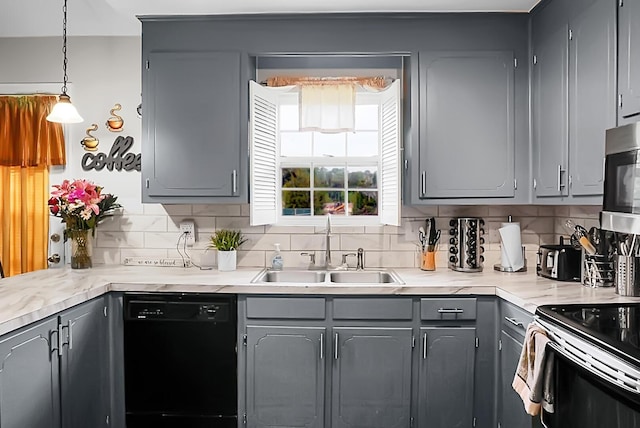 8692 Bentwood Dr, North Charleston, SC 29406 - kitchen featuring appliances with stainless steel finishes, gray cabinetry, and tasteful backsplash