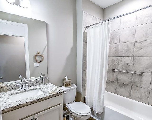 full bathroom with vanity, shower / bath combination with curtain, and toilet