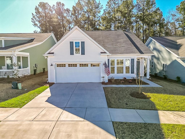 view of front of home featuring a garage and a front lawn