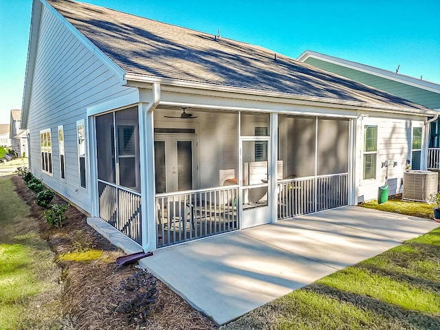 back of property featuring central AC unit, a patio area, and a sunroom