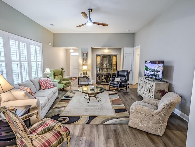 living room with ceiling fan and hardwood / wood-style floors