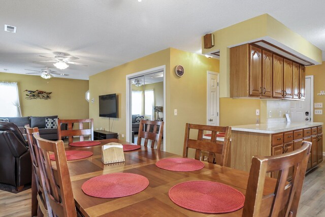 dining room featuring hardwood / wood-style flooring and ceiling fan