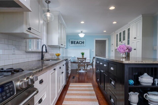 375 Seewee Cir, Mount Pleasant, SC 29464 - kitchen with stainless steel gas stove, a sink, white cabinets, extractor fan, and recessed lighting