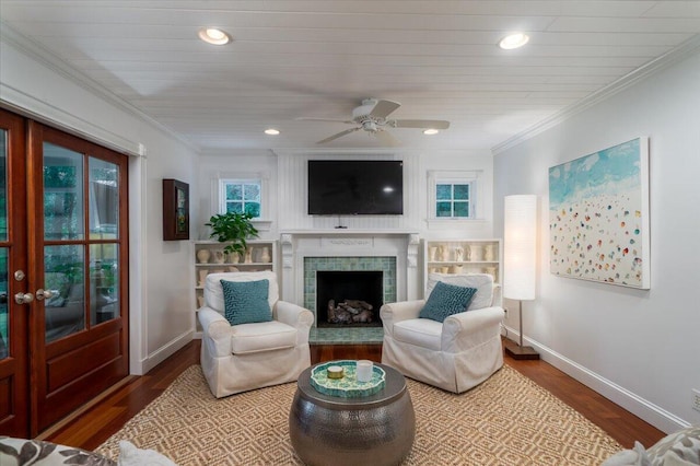 375 Seewee Cir, Mount Pleasant, SC 29464 - living room with baseboards, wood finished floors, a ceiling fan, a tile fireplace, and ornamental molding