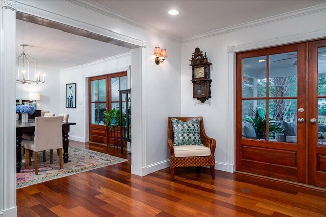 375 Seewee Cir, Mount Pleasant, SC 29464 - foyer entrance with a chandelier, wood finished floors, baseboards, crown molding, and plenty of natural light