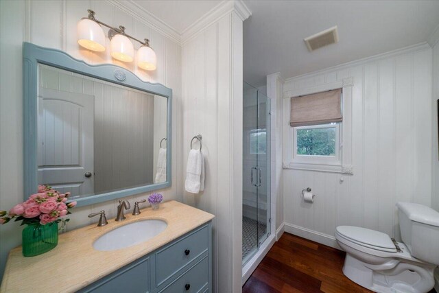 375 Seewee Cir, Mount Pleasant, SC 29464 - full bathroom featuring toilet, wood finished floors, vanity, a shower stall, and ornamental molding