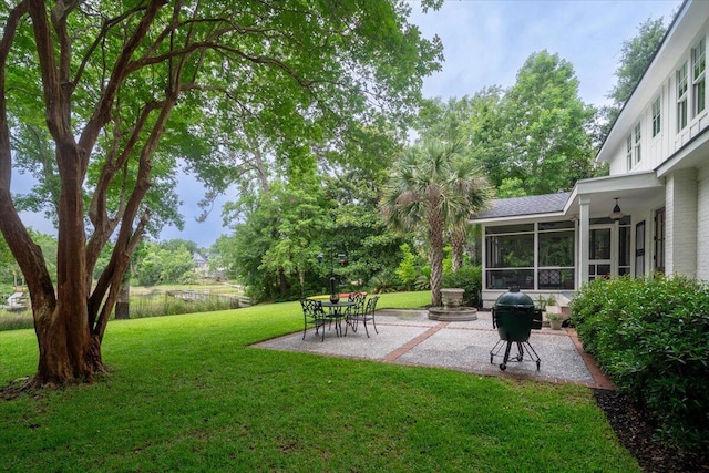 375 Seewee Cir, Mount Pleasant, SC 29464 - view of green lawn with a patio and a sunroom