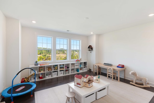 playroom with recessed lighting, wood finished floors, and visible vents