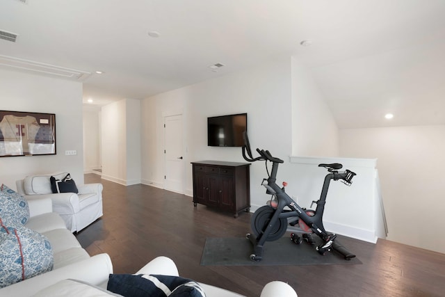 interior space with attic access, visible vents, wood finished floors, baseboards, and recessed lighting