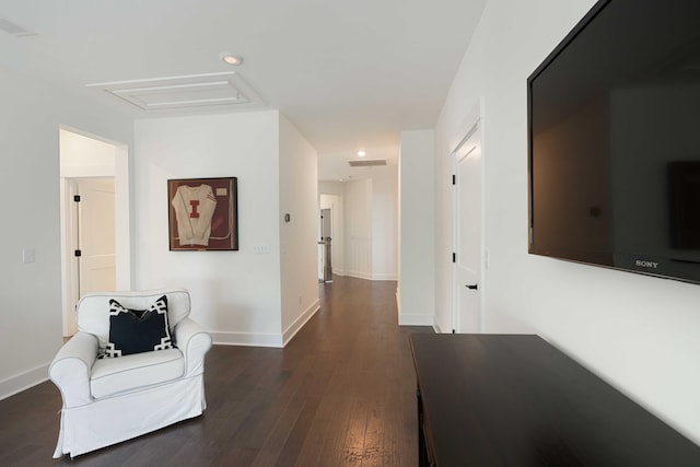 hallway featuring recessed lighting, baseboards, dark wood-style floors, and visible vents