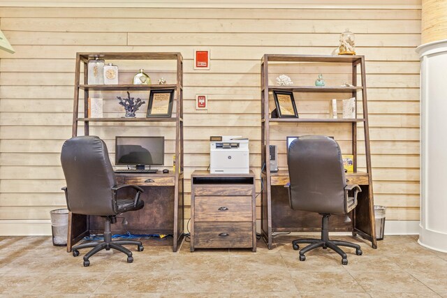 office area featuring wooden walls