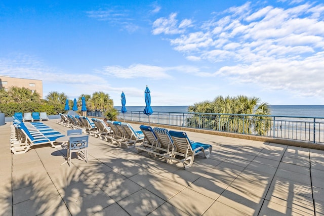 view of patio with a water view